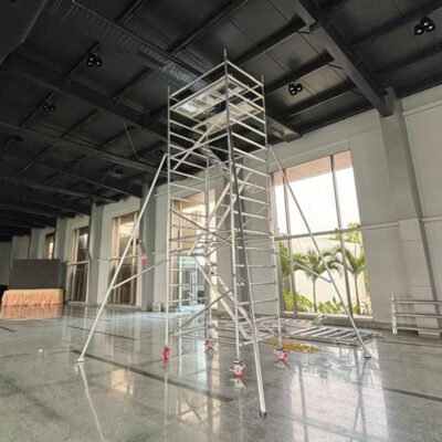 Industrial aluminium scaffolding ladder manufacturer in Hyderabad, mobile tower ladder with wheels and safety platform.
