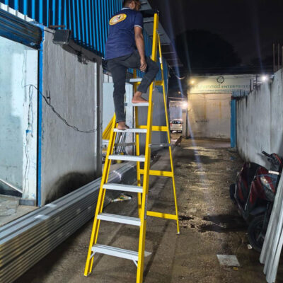 Non-conductive FRP platform ladder with safety handrails manufactured in Hyderabad for electrical and industrial maintenance.